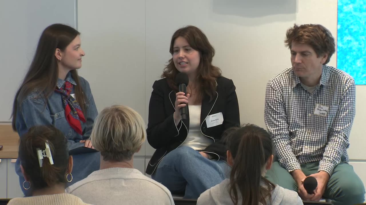 Greta Reich speaking at the H-Corps event